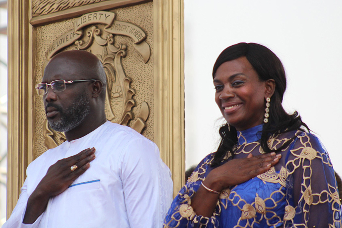 Liberian President George Manneh Weah and his wife, Clar Marie Weah, salute their flag during inauguration ceremonies in Monrovia. Photo by E Julu Swen, UMNS.