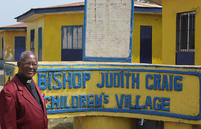 The Rev. Robert N. Sieh, director of The United Methodist Church’s Bishop Judith Craig Children’s Village, stands outside the center. Photo by E Julu Swen, UMNS.