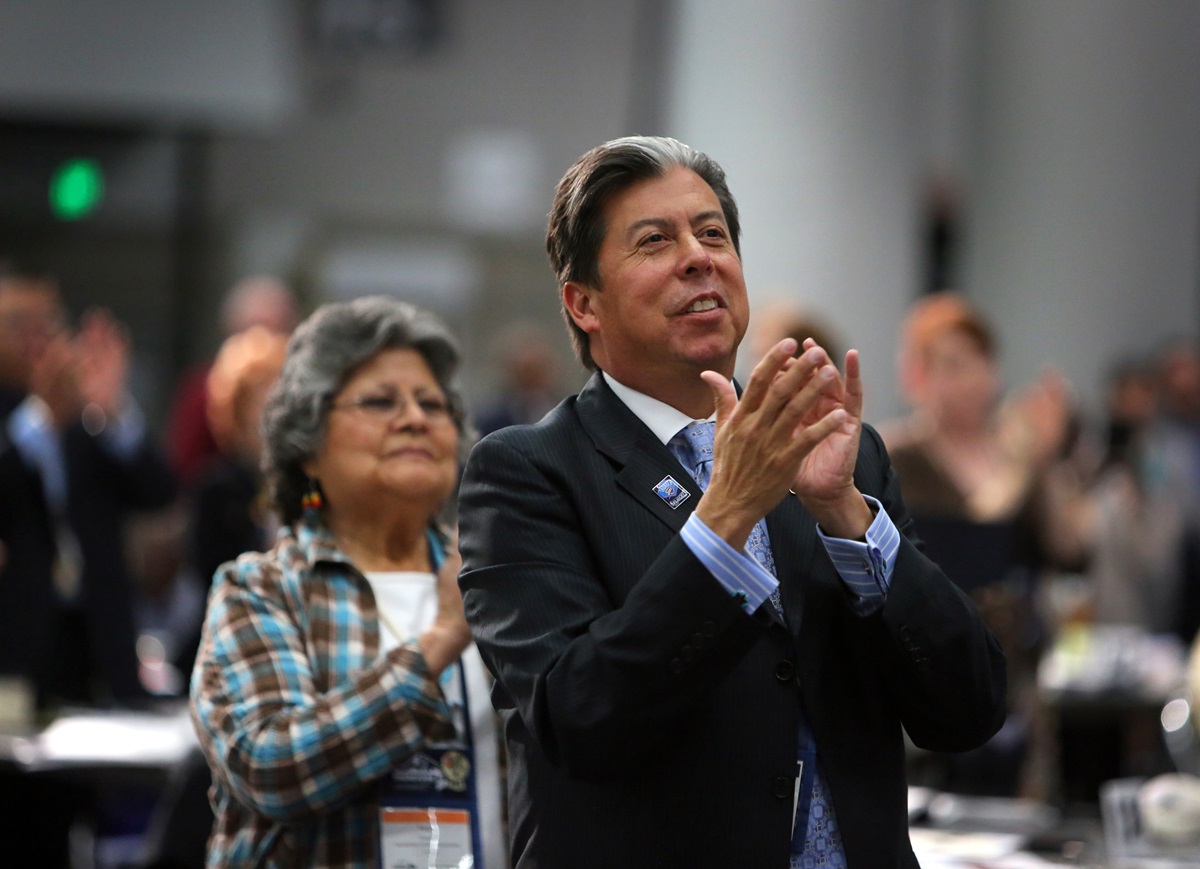 Pearl Thomas and the Rev. David Wilson clap along to the music of the Africa University touring choir during the 2016 United Methodist General Conference in Portland, Ore. Photo by Kathleen Barry, UMNS.