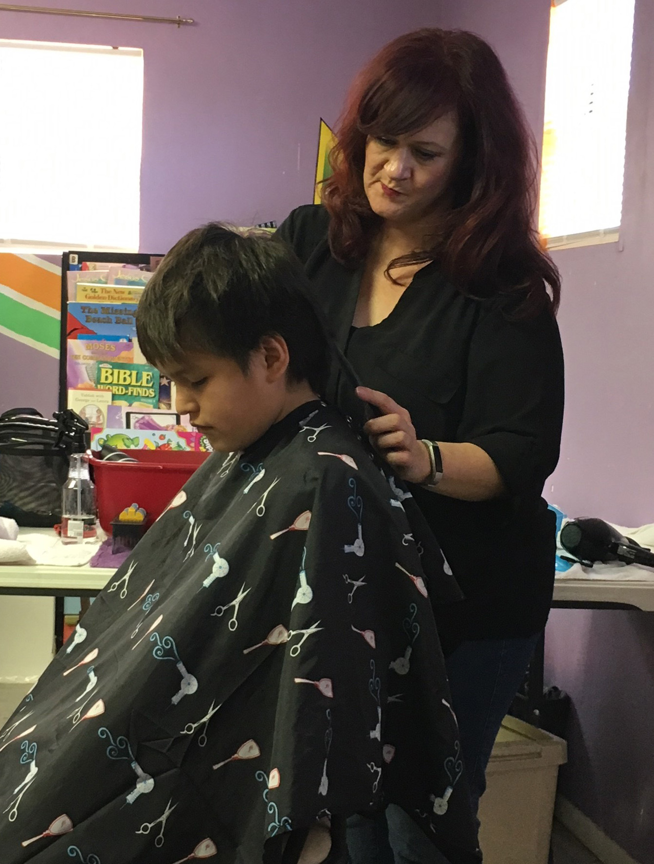 Nikki Humbles, a licensed cosmetologist from Brock, Texas, drove four hours on Jan. 27, 2018, to provide free haircuts to Native youth at Clinton Church and Community Center in Clinton, Okla. Humbles became involved with the Clinton ministry after attending a mission trip with Brock United Methodist Church in July 2016. Photo courtesy of Clinton Church and Community Center.