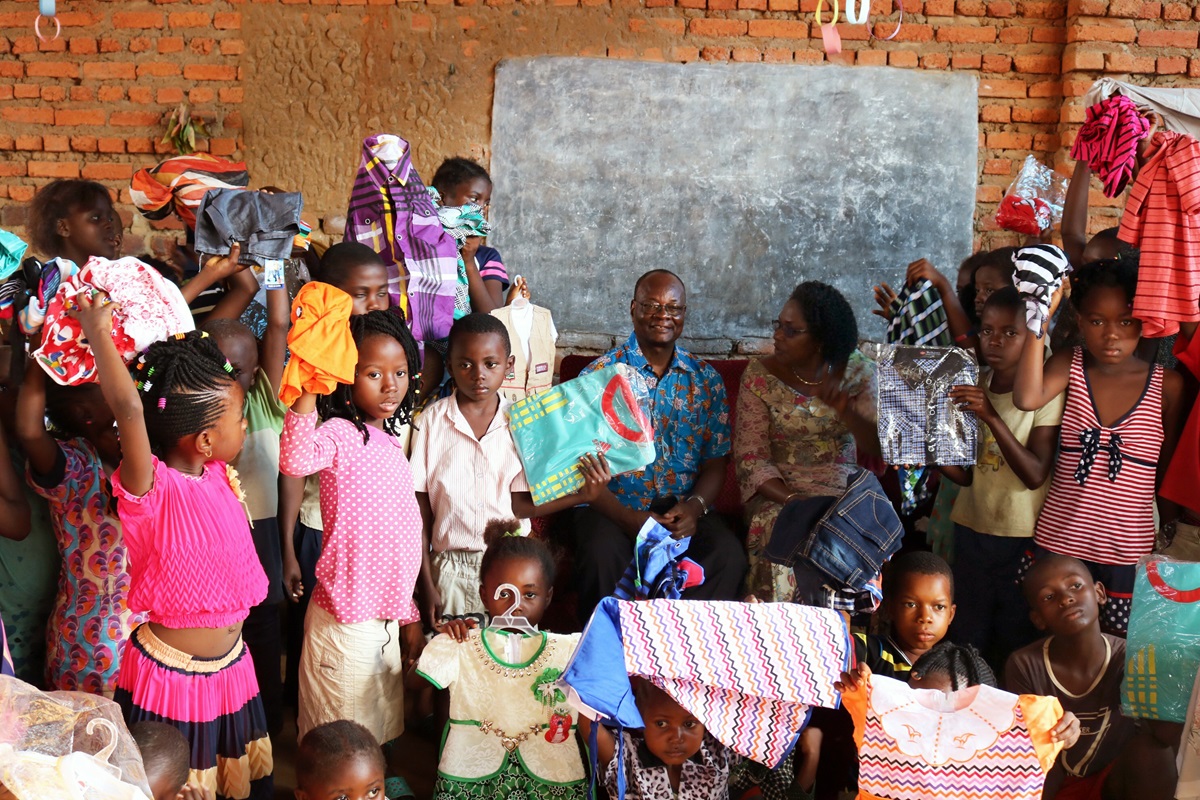 Orphans are being sheltered in a church orphanage in Kindu or with host families after rebel violence in the Democratic Republic of Congo displaced residents there. Seated (center, in blue shirt) is East Congo Area Bishop Gabriel Yemba Unda, along with his wife, Marie Claire Unda (to his right), who has been gathering the orphans for Bible study and meals twice a week. 
