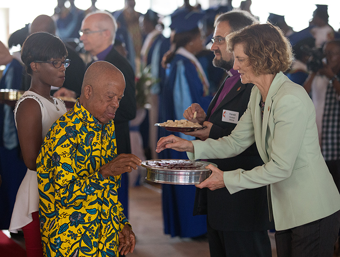 United Methodist Bishops Laurie Haller (right) and Harald Rückert serve Holy Communion during worship at Canaan United Methodist Church in Abidjan, Côte d'Ivoire. Members of the Standing Committee on Central Conference Matters worshipped at the church during a break from their meeting in Abidjan. Photo by Mike DuBose, UMNS.