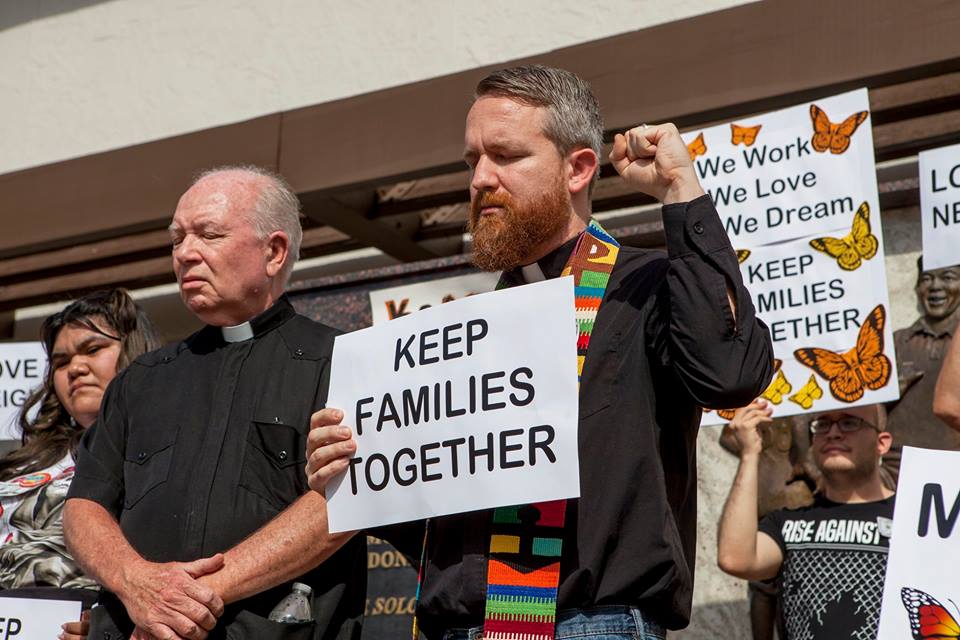 The Rev. Andy Oliver, left, attends a rally for immigrants held outside the Hillsborough County Sheriff Office in Tampa, Fla., on Feb. 9 following the deportation of Luis Blanco to Mexico. The rally was attended by activists and religious leaders. Photo by Kimberly DeFalco.