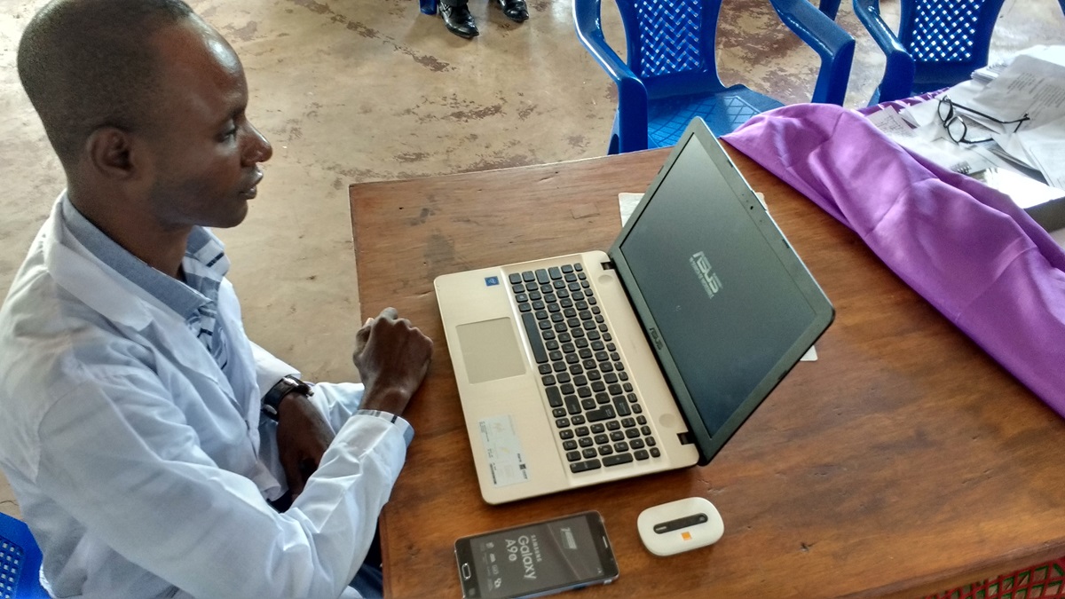 Dr. Kaly Kayamba Tombe uses new equipment supplied by the North Katanga Conference in the Democratic Republic of Congo. Tombe said he will use his computer daily to register patients for the center’s records, and the tools will contribute to improvements in patient health. Photo by the Rev. Betty Kazadi Musau, UMNS