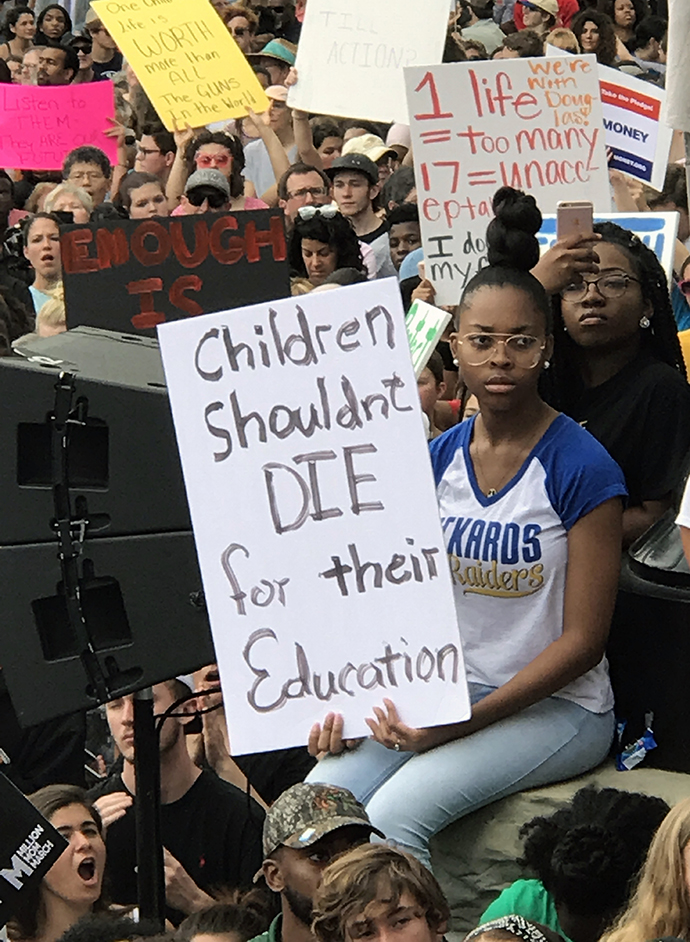 A girl holds a sign reflecting the urgency of the demand for a change in gun laws at a rally of students and adults at the Tallahassee, Florida, state capitol on Feb. 21. Photo by the Rev. Andy Oliver.