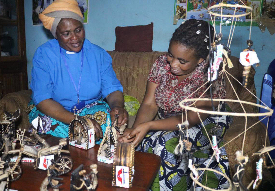 The Rev. Marie Dundja (left) trained Esperance Linda (right) to make arts and crafts so that she could earn income to support her family. Now Linda will be training other girls and mothers in the Democratic Republic of Congo. Photo by Philippe Kituka Lolonga, UMNS.