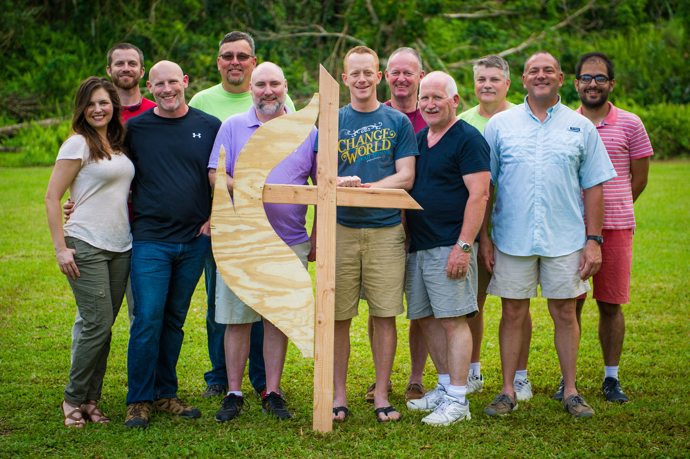 The South Carolina mission team poses with a handcrafted cross and flame they made for the Methodist Camp in Arecibo, Puerto Rico, where the team was housed. Photo by Matt Brodie.