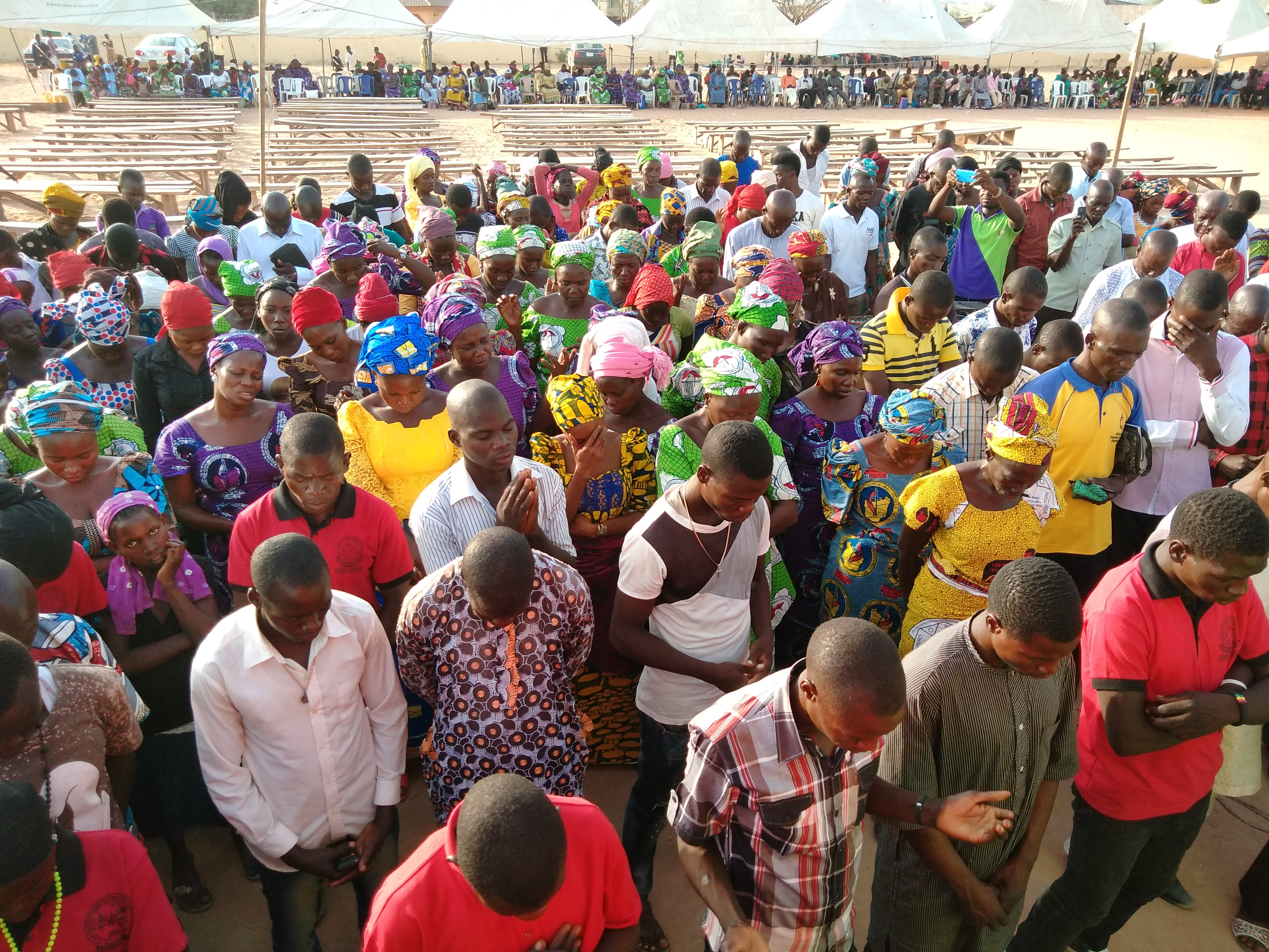 Members of the Southern Nigeria Conference pray during the 2018 Christian Revival Gathering held March 14-18 in Jalingo, Nigeria. More than 12,000 members attended, including a group who had left the conference five years ago. Photo by Ande I. Emmanuel, UMNS.