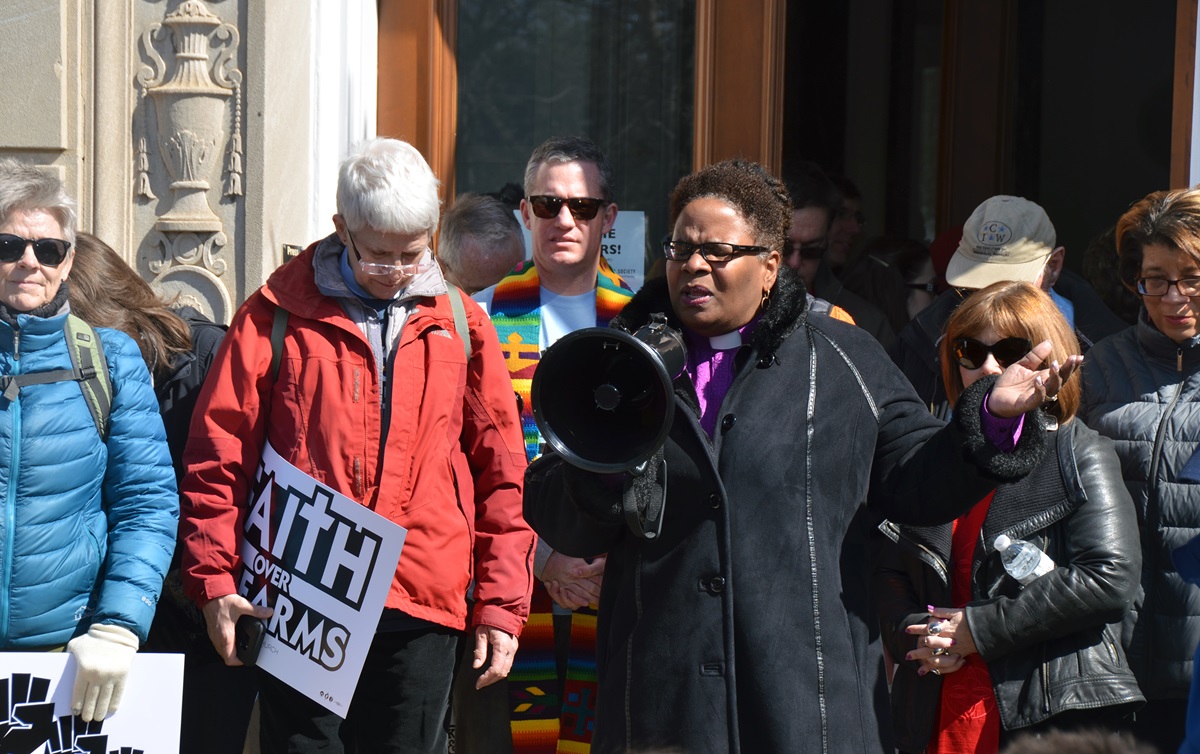 Bishop LaTrelle Easterling, the episcopal leader of the Baltimore-Washington Conference (center), along with other members from Foundry United Methodist Church in Washington, stand in front of the United Methodist Building before the rally. Photo by Sheila George.