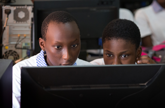 Students share a computer at the United Methodist Anyama School in Abidjan. Photo by Mike DuBose, UMNS.