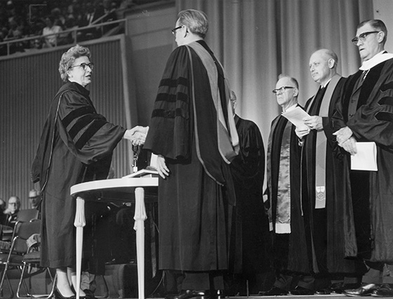 Lay adult members Emma Tousant of the Evangelical United Brethren and J.P. Zepeda of the Methodist Church shake hands as part of the uniting ceremony that marked the formation of The United Methodist Church in 1968. This moment of celebration was years in the making. Photo courtesy of Archives and History.  