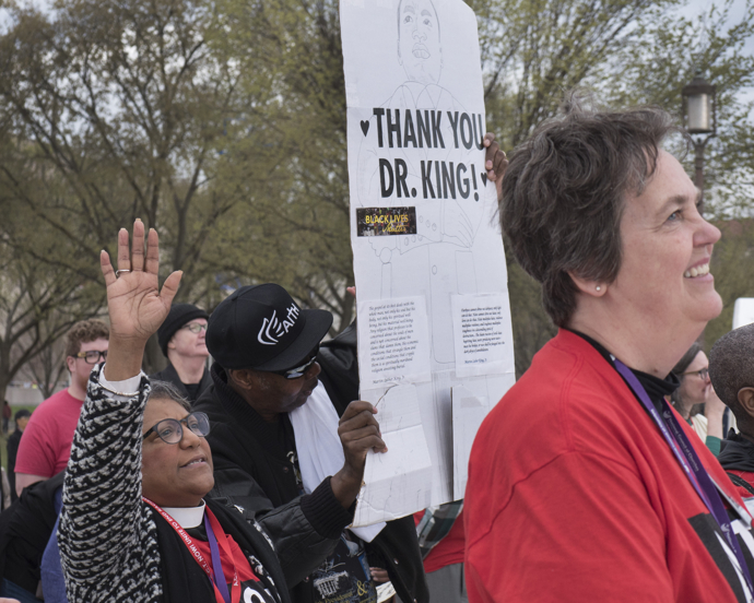 A poster thanking the Rev. Martin Luther King Jr. is held in the crowd at the A.C.T. to End Racism Rally. Photo by Kathy L. Gilbert, UMNS