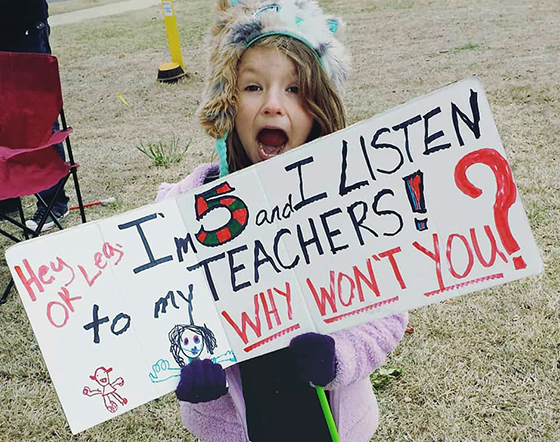 Tess Junger, a student at Monroe Elementary, Oklahoma City, participates in a demonstration of support for the teachers asking for better wages and conditions. Photo courtesy of Whiney White Junger.