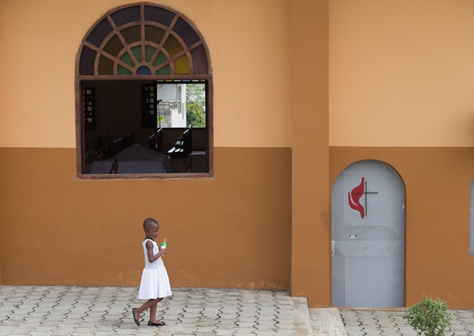 A young girl arrives for Sunday worship at Nazareth United Methodist Church in Abidjan, Côte d'Ivoire. Photo by Mike DuBose, UMNS.