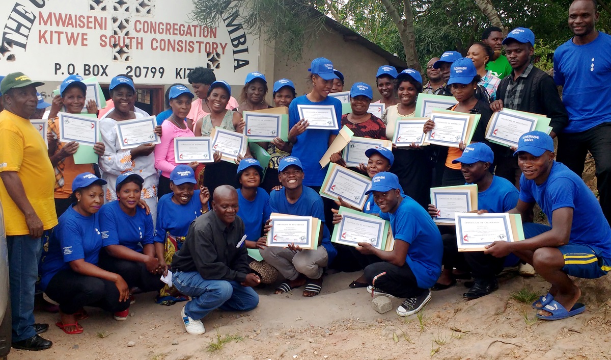 More than 20 community volunteers were trained to take care of the new boreholes, sinks and toilets in Mwaiseni, Zambia. Photo by John Chikuta, UMNS.