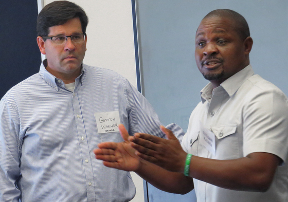 The Rev. Gaston Warner and Reegan Kaberia of the anti-poverty nonprofit ZOE lead a workshop at the Beyond These Walls mission conference at Chapelwood United Methodist Church in Houston. Photo by Sam Hodges, UMNS.