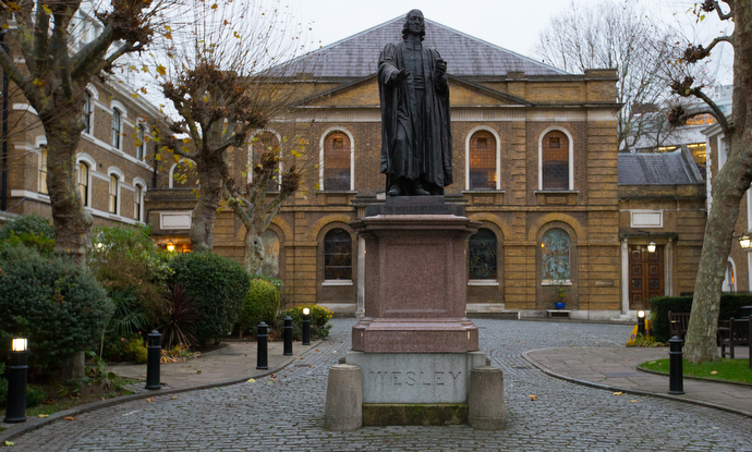 At statue of John Wesley sculpted by John Adams-Acton stands in the forecourt of Wesley's Chapel. Photo by Mike DuBose, UMNS.