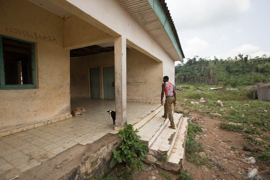 Boh Lion, a fisherman and village elder, walks up the steps of the abandoned health clinic in Monogaga. Lion says the clinic has not been used since the doctor left some years ago. 
