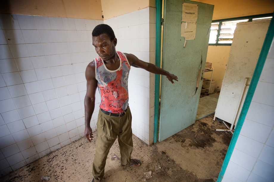 Boh Lion, a fisherman and village elder, walks through the abandoned health clinic in Monogaga. Lion says the clinic has not been used since the doctor left some years ago. The village chief says he hopes The United Methodist Church will reopen the clinic.