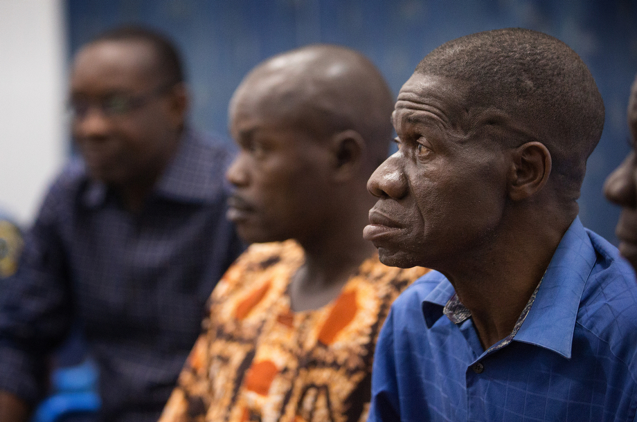 Health workers watch a video presentation about preventing the spread of Ebola in Man.  