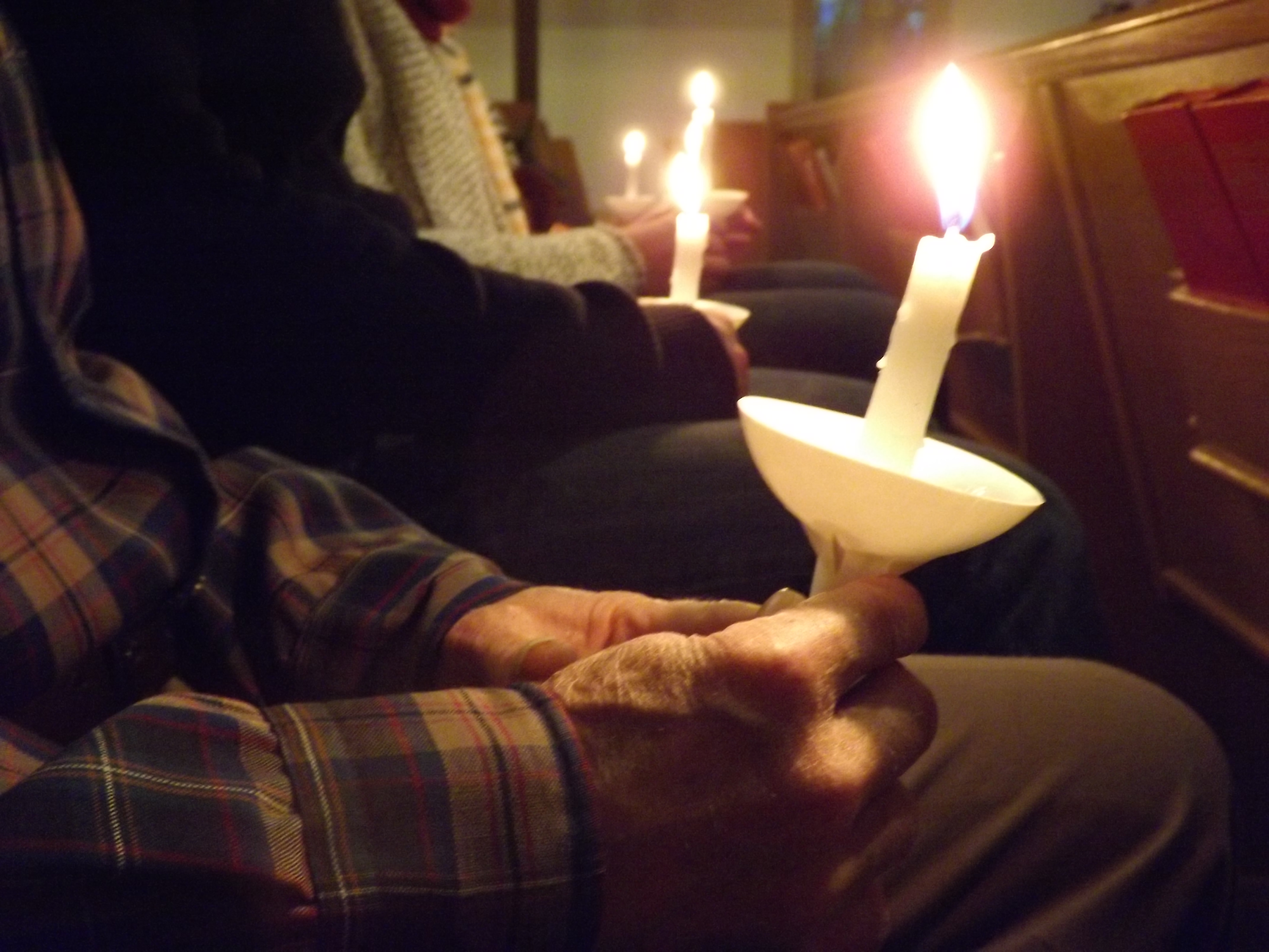 People gather to pray for Dr. Martin Salia at Hanscom Park United Methodist Church in Omaha, Neb., Nov. 16. 