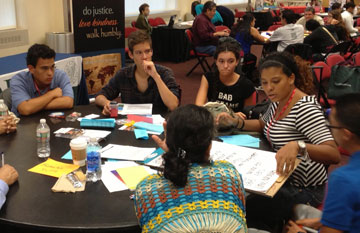 Yolanda M. Santiago and other young adults share in their small group session.