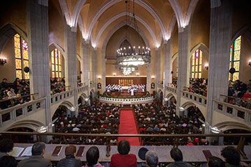 Parishioners fill the pews during worship at Mu'en Church in Shanghai, China.