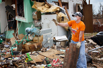 Mel Rogers clears tornado debris at a home in Moore, Okla. Rogers was part of a volunteer team working out of First United Methodist Church in Moore.