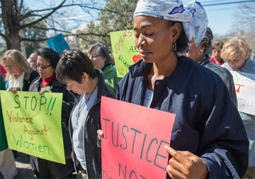 The Rev. Eunice Musa Iliya (right) participates in an International Women's Day vigil, sponsored by United Methodist Women. Photo by Kristina Krug, courtesy of United Methodist Women.