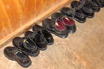 Shoes of the preschoolers are lined up awaiting the end of nap time. A UMNS photo by Emmauel Taurai Maforo.