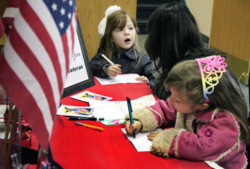 Children at First United Methodist Church of Lancaster, Pa., write thank-you notes to give to wounded veterans and those serving in the military.