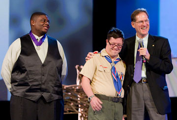 Boy Scouts Justin Jackson (left) and Ryan Wilson receive The United Methodist Church's Good Samaritan Award from Larry Coppock during the 2012 United Methodist General Conference in Tampa, Fla. Coppock is director of Scouting Ministries at the Commission on United Methodist Men. A UMNS photo by Mike DuBose.