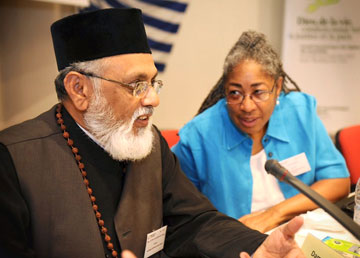 Evelyn Parker, U.S., and the Rev. Kondothra M. George, from the Malankara Orthodox Syria Church in India, lead a Bible study at the recent World Council of Churches Central Committee meeting in Crete. A web-only photo courtesy of World Council of Churches/Mark Beach.