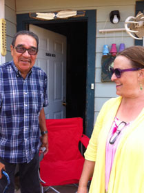 JuDee Anderson (right) visits with Charles Little Old Man, a spiritual leader on the reservation.