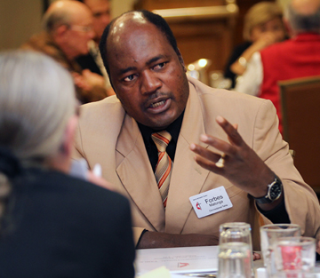 The Rev. Forbes Matonga of Zimbabwe makes a point during a meeting of the Connectional Table. A UMNS photo by Kathleen Barry.