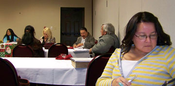 Sunrise Ross (foreground), chairperson of the Northern District leadership team, and others study activities of the lay missionary planting sessions. A UMNS photo by Julienne Judd.