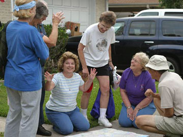 The Rev. Marilyn Roeder, center in stripped shirt, has brought mission teams from Victoria, Texas, to New Orleans 11 times since Hurricane Katrina struck. A UMNS photo by Kathy Gilbert.
