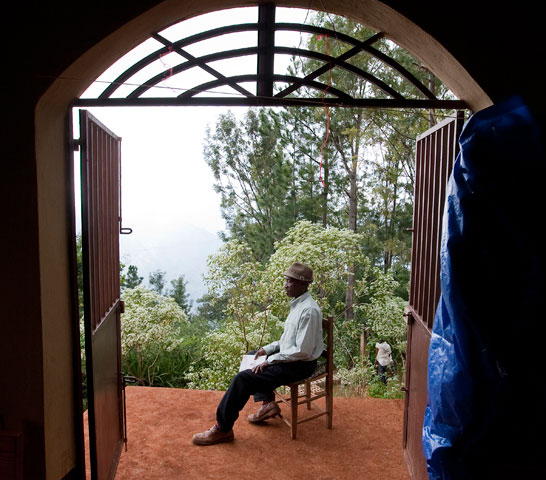 Pastor Louis Elias rests on the front steps of the Furcy Methodist Church.