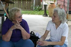 Volunteer Lori Coonce (left) talks with Joyce Mohr, a New Orleans resident whose home was destroyed by Hurricane Katrina. A UMNS photo by Kathy L. Gilbert.