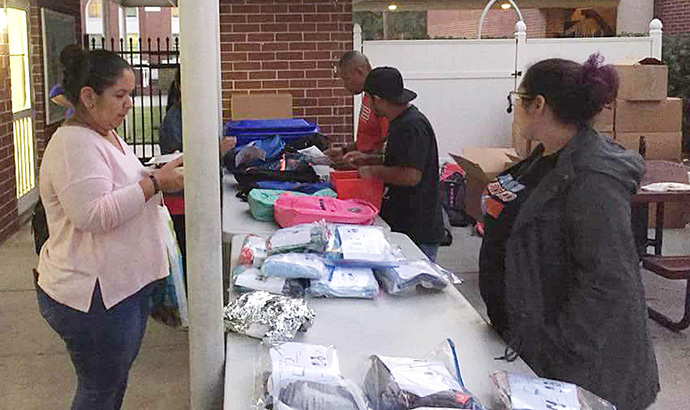 Volunteers from First United Methodist Church of Kissimmee, Fla., pack basic household and school supplies for families who were displaced by Hurricane Maria in Puerto Rico. Photo courtesy of the Rev. Jose Nieves.