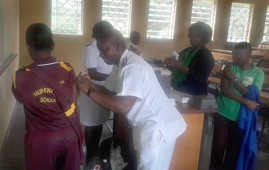 A student at Murewa United Methodist Mission School receives a human papillomavirus vaccine. The vaccine protects against cervical cancer. Photo by Sydney Mapisaunga, deputy head of the school