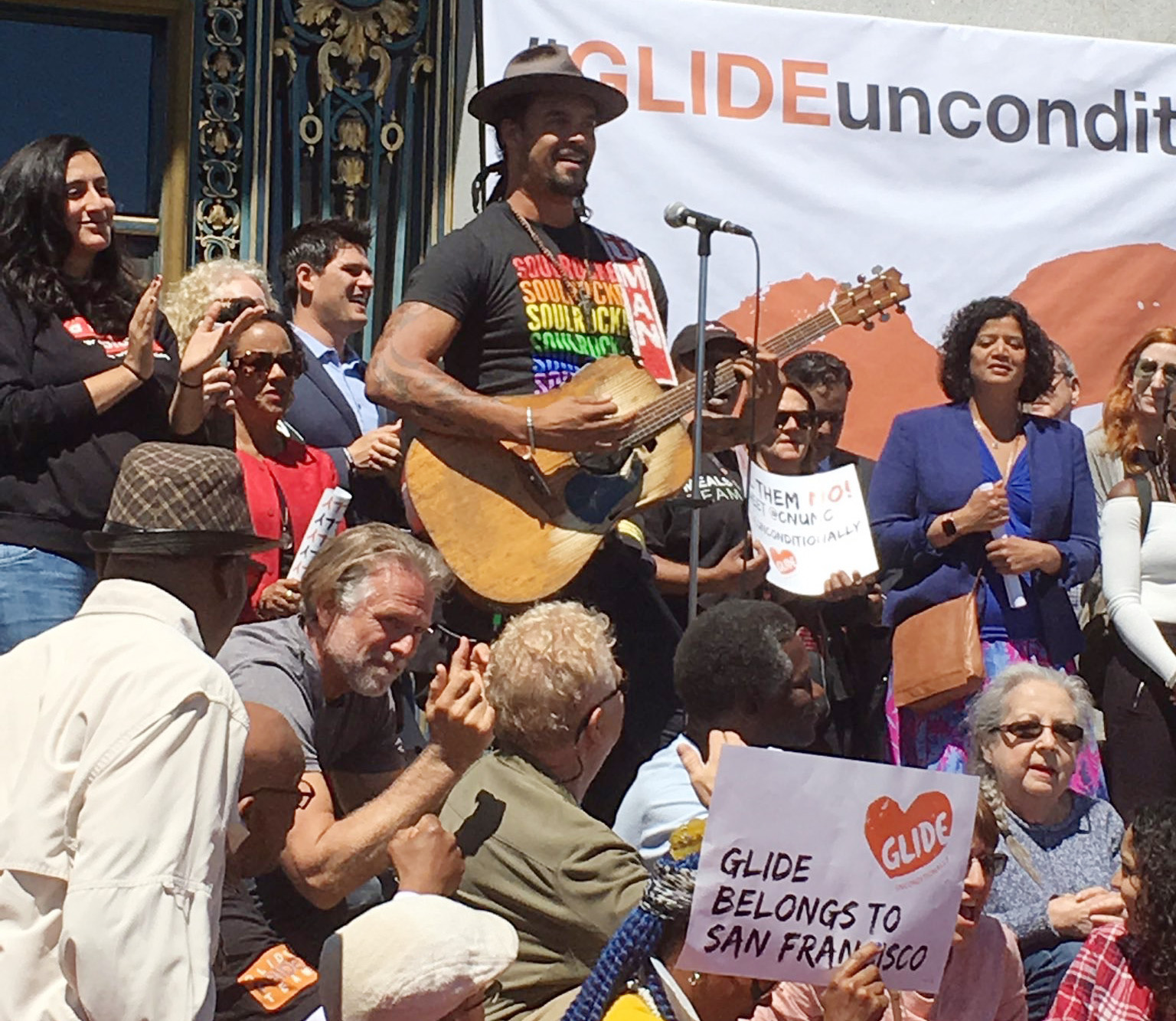 Singer Michael Franti joins the rally for Glide Memorial United Methodist Church in front of San Francisco’s City Hall on June 21. Photo by Beth Frankland