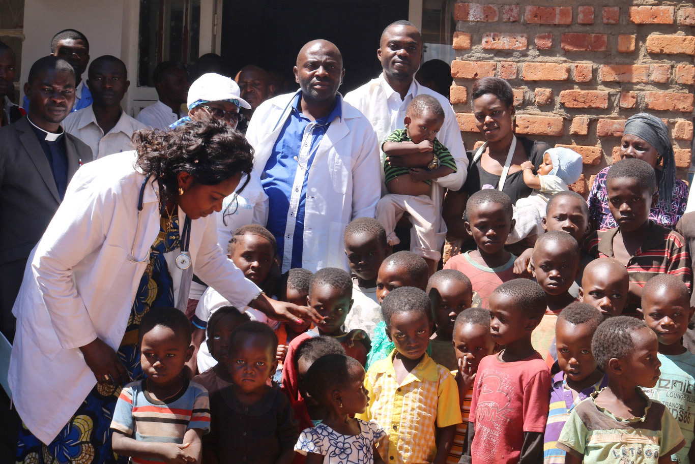 Dr. Marie Claire Manafundu (left) visits children in the Irambo neighborhood in Bukavu, Democratic Republic of Congo, where poor nutrition has become a problem, especially for children. Photo by Philippe Kituka Lolonga, UMNS. 