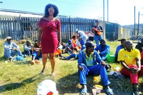 Nombhedesho Maquba (standing, left) volunteers with a soup kitchen ministry operated by young adults of The United Methodist Church of South Africa in Durban. Photo by Nandipha Mkwalo, UMNS.