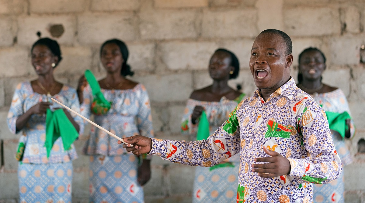 Edmond Assamoi directs the choir at a recently opened United Methodist church outside Agboville, Côte d'Ivoire. The church is so new that it has not yet been named. Photo by Mike DuBose, UMNS. Edmond Assamoi directs the choir at a recently opened United Methodist church outside Agboville, Côte d'Ivoire. The church is so new that it has not yet been named. Photo by Mike DuBose, UMNS.