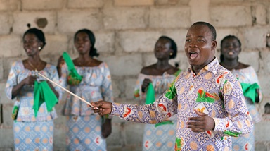 Edmond Assamoi directs the choir at a recently opened United Methodist church outside Agboville, Côte d'Ivoire. The church is so new that it has not yet been named. Photo by Mike DuBose, UMNS. Edmond Assamoi directs the choir at a recently opened United Methodist church outside Agboville, Côte d'Ivoire. The church is so new that it has not yet been named. Photo by Mike DuBose, UMNS.