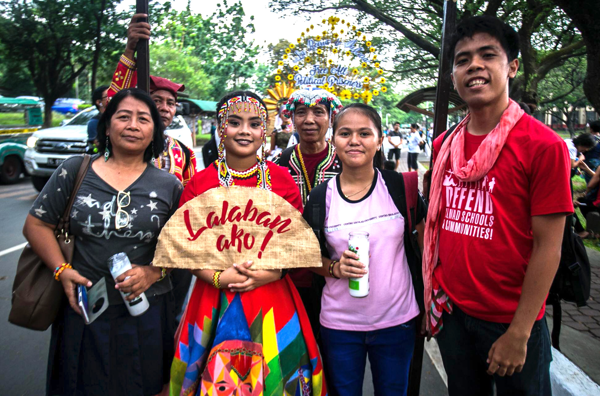 Ofelia A. Cantor (left) stands with the “Queen of Peace,” and others in a parade protesting tyranny by the government, May 26, at the University of the Philippines, Quezon City. United Methodist Women joined human rights defenders in a call to end martial law in the Philippines. Photo courtesy of Mark Z. Saludes. 