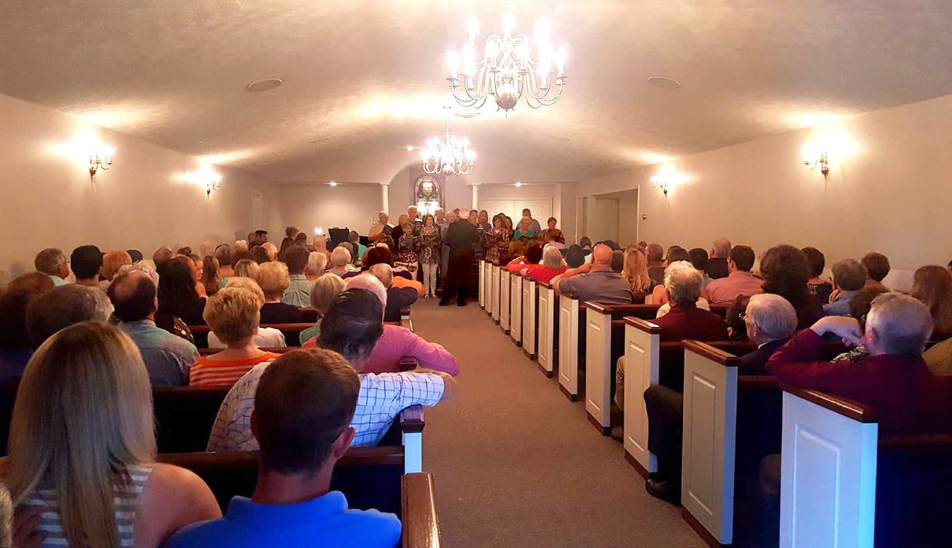 Worshippers, many of whom voted to withdraw from The United Methodist Church, join in a service May 27 at the Porter Funeral Home Chapel in Louisville, Miss. The Mississippi Conference is seeking to keep First United Methodist Church property in United Methodist hands. Photo courtesy of the Rev. Mike Childs. 