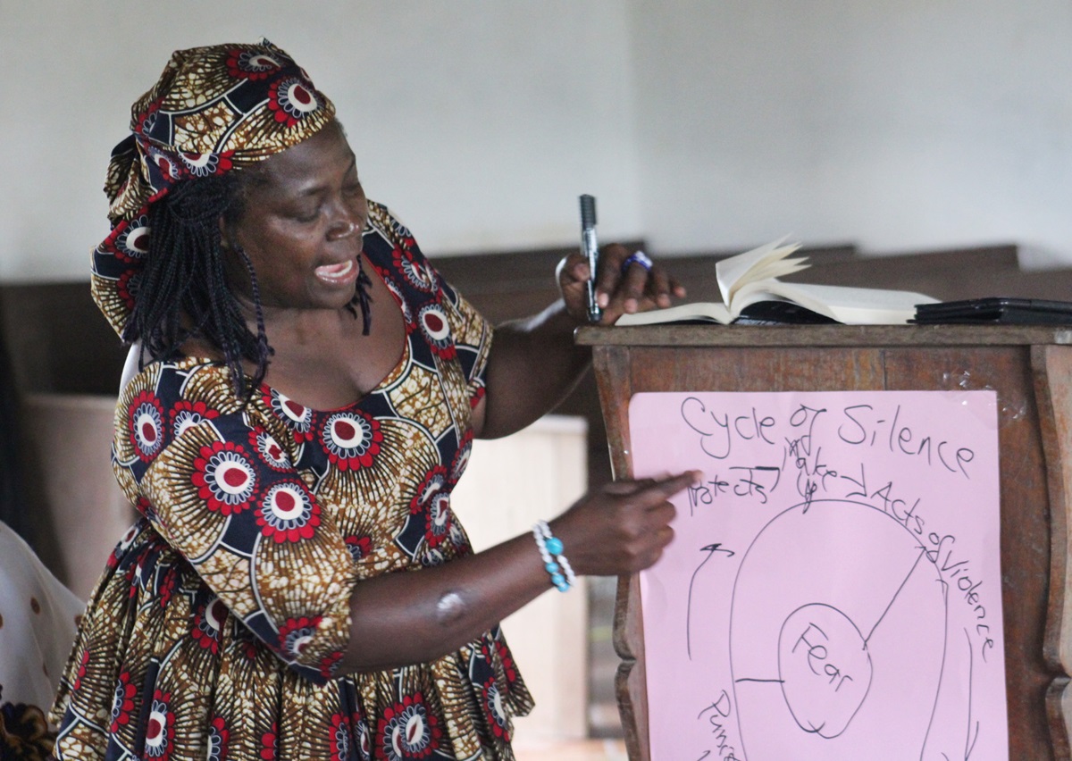 Muriel V. Nelson, president of United Methodist Women of Liberia, leads a discussion on breaking the cycle of violence against women during a four-day Ubuntu Missionary Journey in Diecke, Guinea. Photo by E Julu Swen, UMNS. 