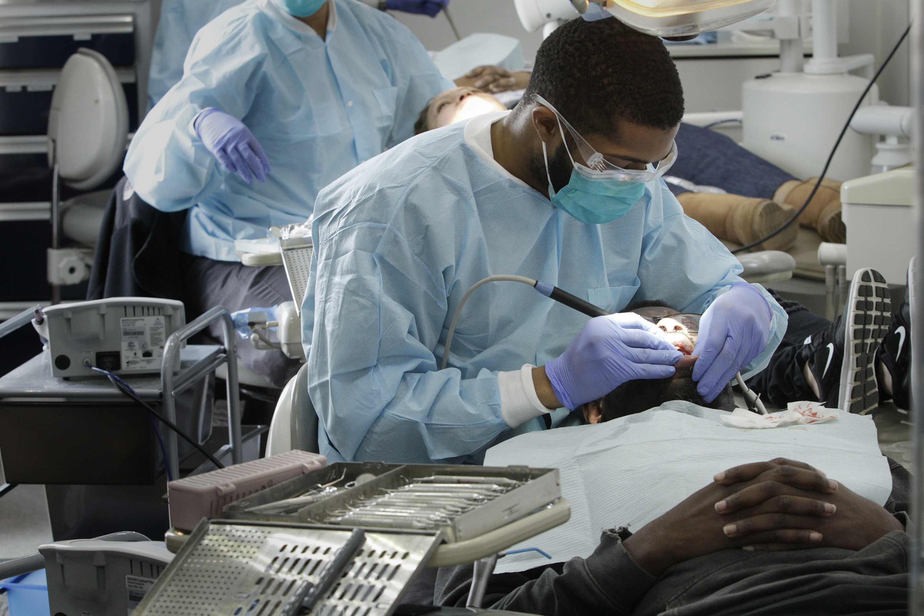 Student dentist Preston Harris sees a patient in the Meharry Medical College mobile dental clinic in Nashville, Tenn. Photo courtesy of Meharry Medical College.